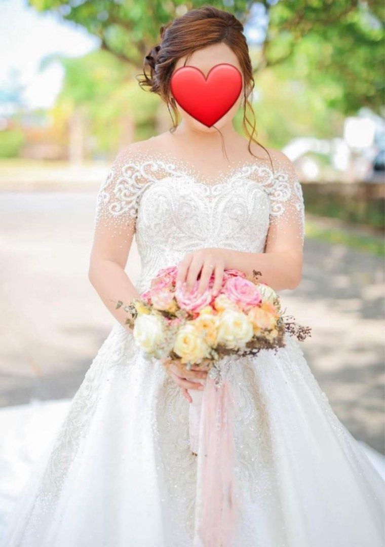 Preloved Wedding Gown by Mark’s Bride Manila (Category: Evening dresses & gowns) located in Quezon City. Submitted by gelleebeans (Listing ID 1370762894, Image 1). Description: ❤ high quality, fully beaded wedding gown with swarovski crystals made by Mark Brides Manila ❤ with long trail ❤ can fit medium body frame (33-28-34) ❤ inclusions: veil, 6 layer petticoat, cord, accesories ❗️gown is okay however beadwork has some yellowish discoloration wh