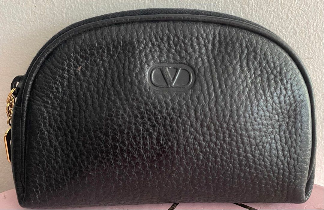 Valentino Garavani Mini Pouch (Category: Luxury Bags & Wallets) located in Pasig City. Submitted by lilhermes (Listing ID 1370692850, Image 1). Description: In very good condition, Height:5.5 inches Wide: 7.7 inches .