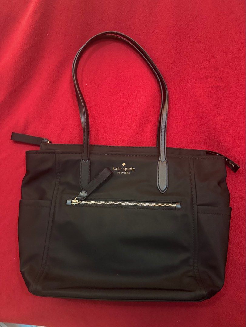 Authentic Kate Spade Chelsea Large (Category: Luxury Bags & Wallets) located in Meycauayan. Submitted by clarissem (Listing ID 1357927356, Image 1). Description: Style Number KC527 Measurements Length: 6.75” Height: 12.25” Width: 13.4”w (bottom) 17.2”w (top) Materials 100% Recycled Nylon Smooth PVC trim Handle Handle Drop:12.00 Features Top zip pocket Front slip back zip pocket Front credit card Slots Drop in top zip closure Key leash Fits larges