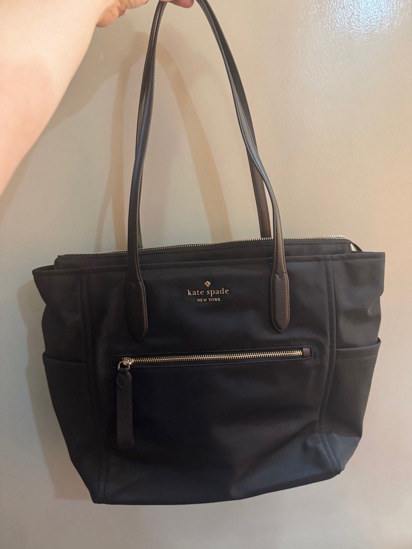 Authentic Kate Spade Chelsea Large (Category: Luxury Bags & Wallets) located in Meycauayan. Submitted by clarissem (Listing ID 1357927356, Image 3). Description: Style Number KC527 Measurements Length: 6.75” Height: 12.25” Width: 13.4”w (bottom) 17.2”w (top) Materials 100% Recycled Nylon Smooth PVC trim Handle Handle Drop:12.00 Features Top zip pocket Front slip back zip pocket Front credit card Slots Drop in top zip closure Key leash Fits larges