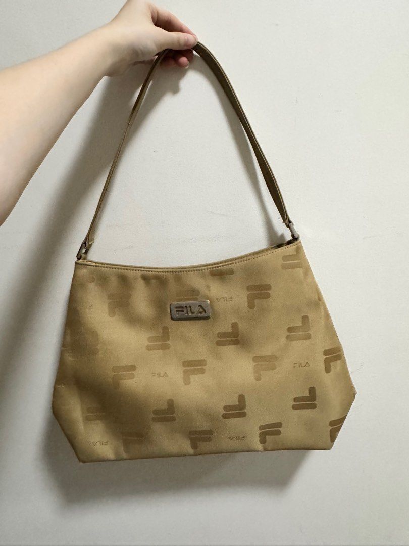 Fila Handbag (Category: Luxury Bags & Wallets) located in Manila. Submitted by lululemonslice (Listing ID 1370945750, Image 1). Description: Negotiable No stains No damage RFS: decluttering.