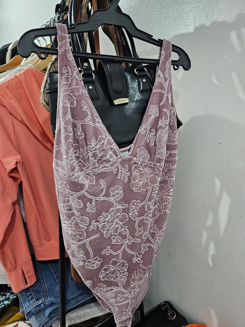 Forever 21 bodysuit (Category: Sleeveless) located in Makati City. Submitted by kathsclosetdeclutter (Listing ID 1370958371, Image 1). Description: Used twice lang. deep V neckline. super pretty fabric and print. i sewed the straps to fit me properly but you can just undo if you prefer. fits S to M.