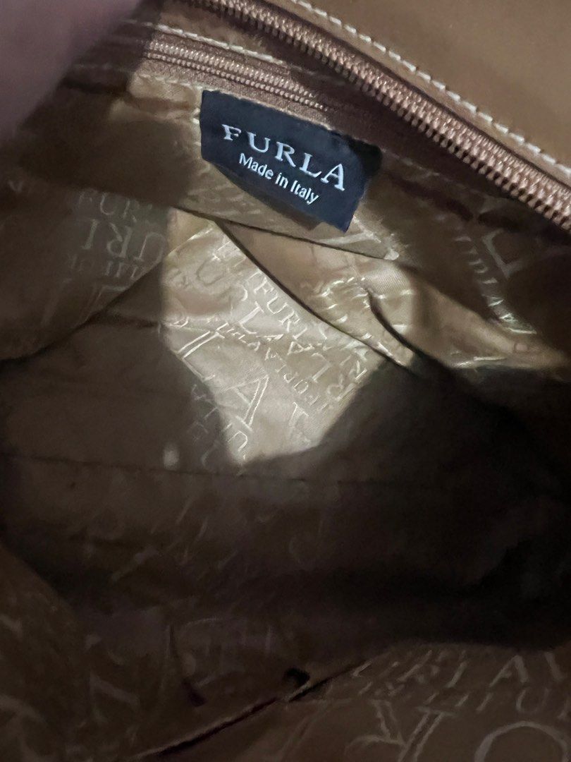 Furla small bag preloved (Category: Tote Bags) located in Quezon City. Submitted by atetski (Listing ID 1370800958, Image 2). Description: Authentic brand Minor flaws Japan source Ready to use Send me offer Gcash payment Lalamove or j&t.