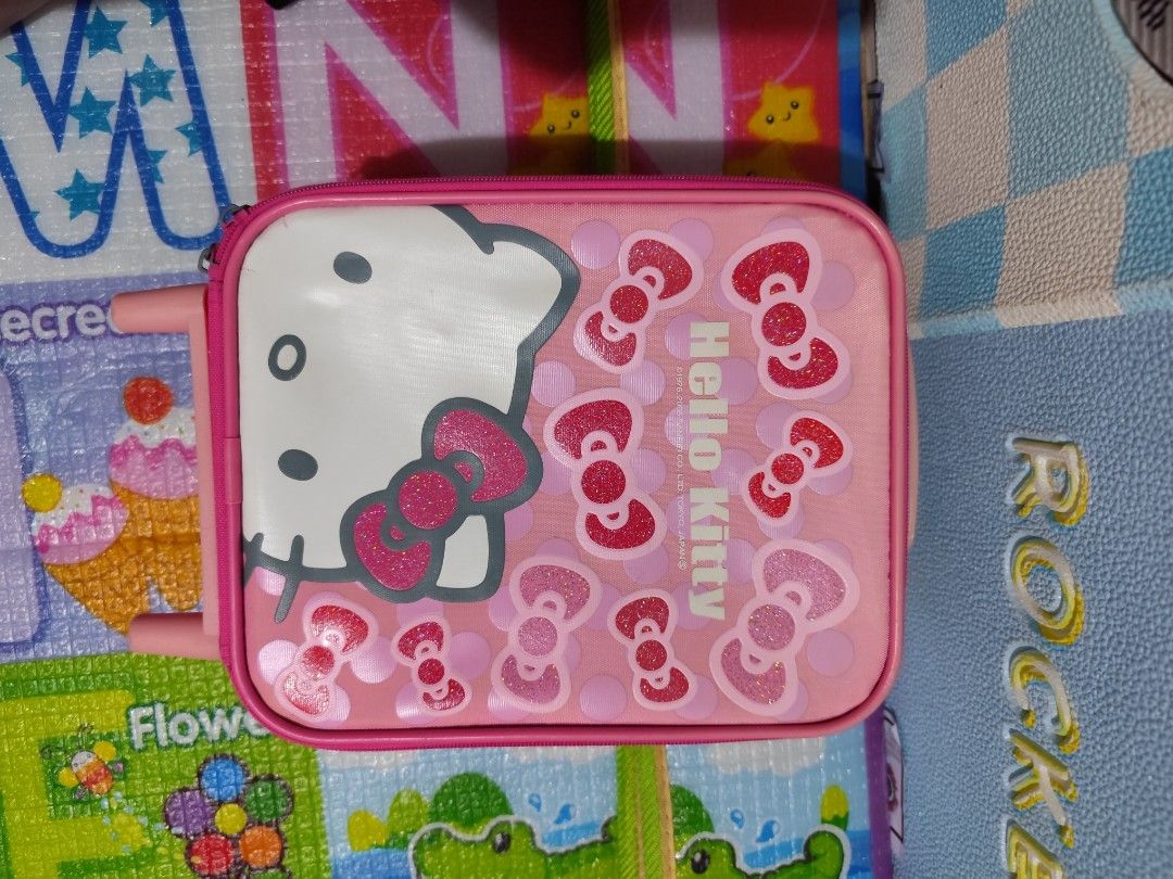 Hello Kitty Luggage (Category: Luggage) located in Manila. Submitted by MissPanda (Listing ID 1370816071, Image 2). Description: Preloved Hello Kitty Luggage bought in Japan. with minimal signs of usage. Issue: Basag yung sa may handle. Kayo na bahala umayos. 😂 300 only.