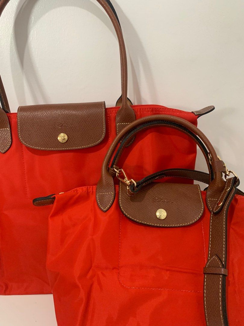 Longchamp Le Pliage in Red (Large) (Category: Luxury Bags & Wallets) located in Manila. Submitted by _girlfinds (Listing ID 1370863187, Image 2). Description: Elevate your daily style with this classic and functional Longchamp tote. 📍 Sourced directly from Japan – self authentication with the provided photos, premium quality. 🎁 Bundles for 2500 - Mix & match combos (subject to availability), ask first: ✔️ 2 Longchamp Bags ✔️ Dust bag or packagi