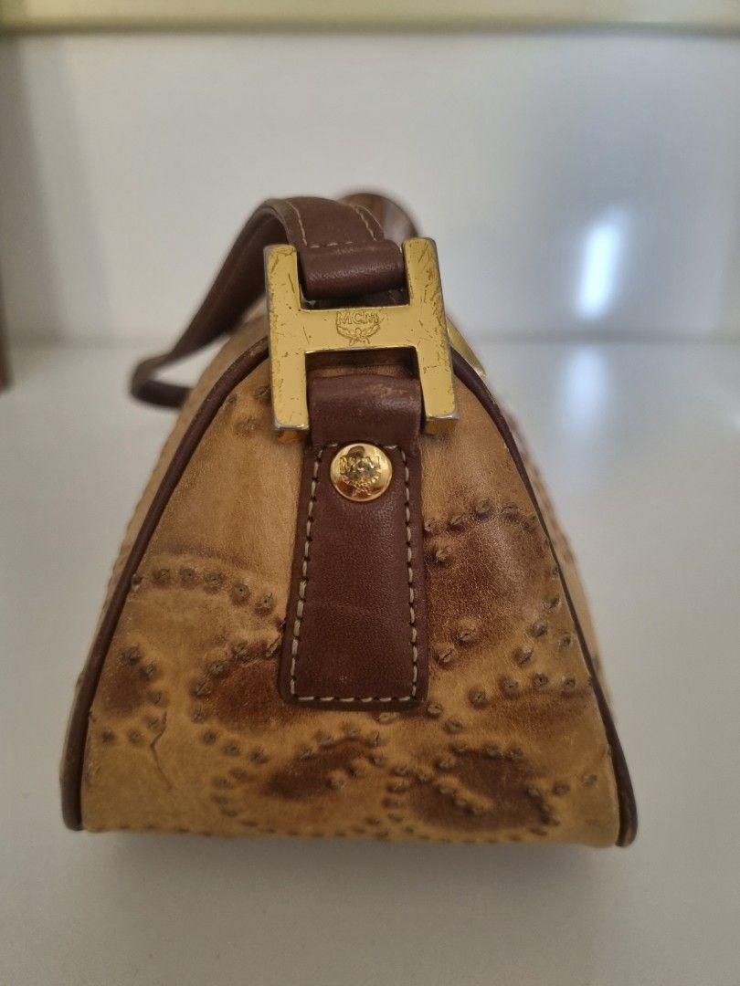 MCM Vintage Leather Hand Tooled Shoulder Bag (Category: Luxury Bags & Wallets) located in Muntinlupa City. Submitted by hcasi (Listing ID 1370978113, Image 2). Description: MCM Vintage Leather Hand Tooled Shoulder Bag Rubs on lining Tarnishing on hardware Minimal dirt inside 2 pockets inside Zipper working properly No cracks on strap Can fit a lot inside Needs bag spa MOP: GCash/Maya/BPI SF: Grab/Lalamove/J&T.