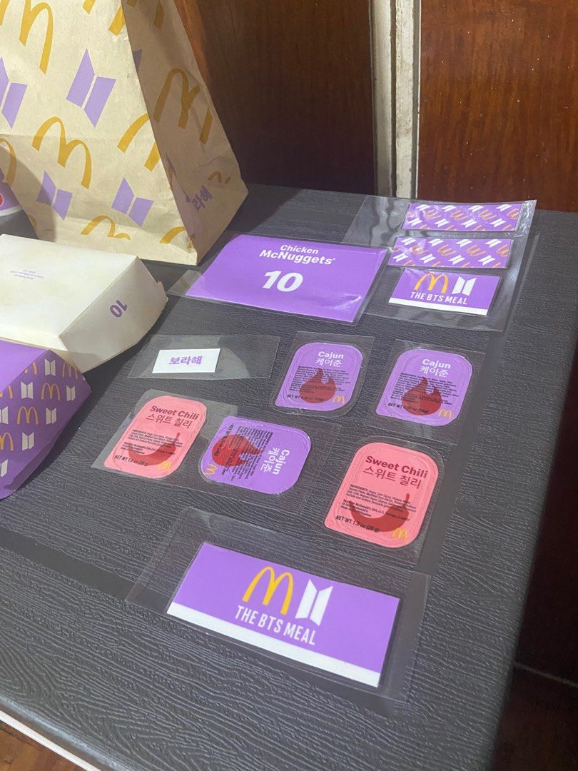 Take all - BTS Meal McDonald's Collection (Category: Character Goods) located in Quezon City. Submitted by addeclutter (Listing ID 1370870178, Image 3). Description: 4pcs paper bag (3 are in prestine condition) 3pcs cups 1pc chicken nuggets box laminated 3pcs Cajun sauce laminated 2pcs Sweet Chili Sauce laminated Dismantled chicken nuggets box with parts laminated.