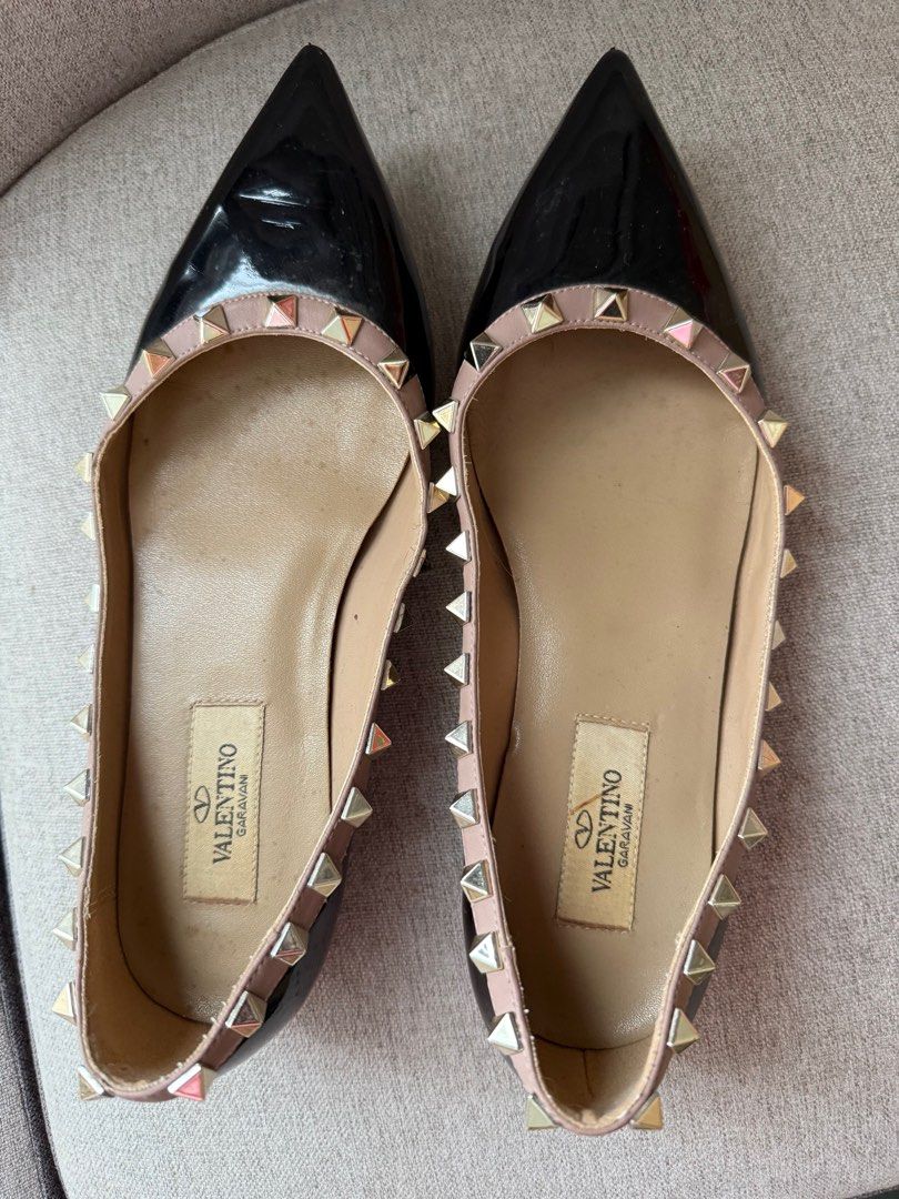 Valentino Garavani Rockstud Flats (Category: Sneakers & Footwear) located in Cebu City. Submitted by halcyone728 (Listing ID 1370878530, Image 1). Description: Condition: Gently used with creasing and minor scuffing Inclusions: None Size: EU36.5 Material: Patent leather upper, leather sole Color: Black .