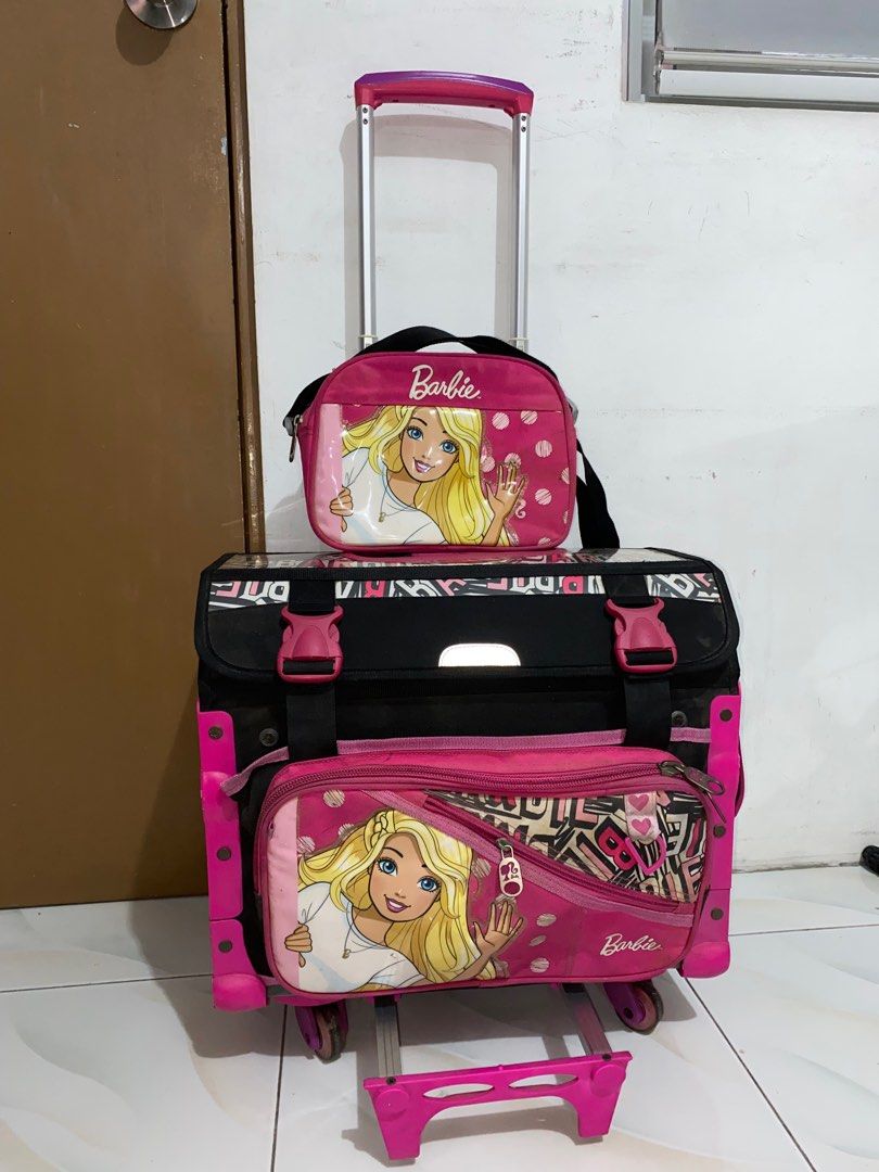 Barbie Trolley Bag (Category: Strollers) located in Quezon City. Submitted by ziaianana (Listing ID 1371130144, Image 1). Description: Can Negotiate on price Details: 7k+ og price Only used for one school year Complete accessories Bag cover needs a wash & has a name May patungan ng paa & can sit on it Very spacious ang loob Dm me for more details.