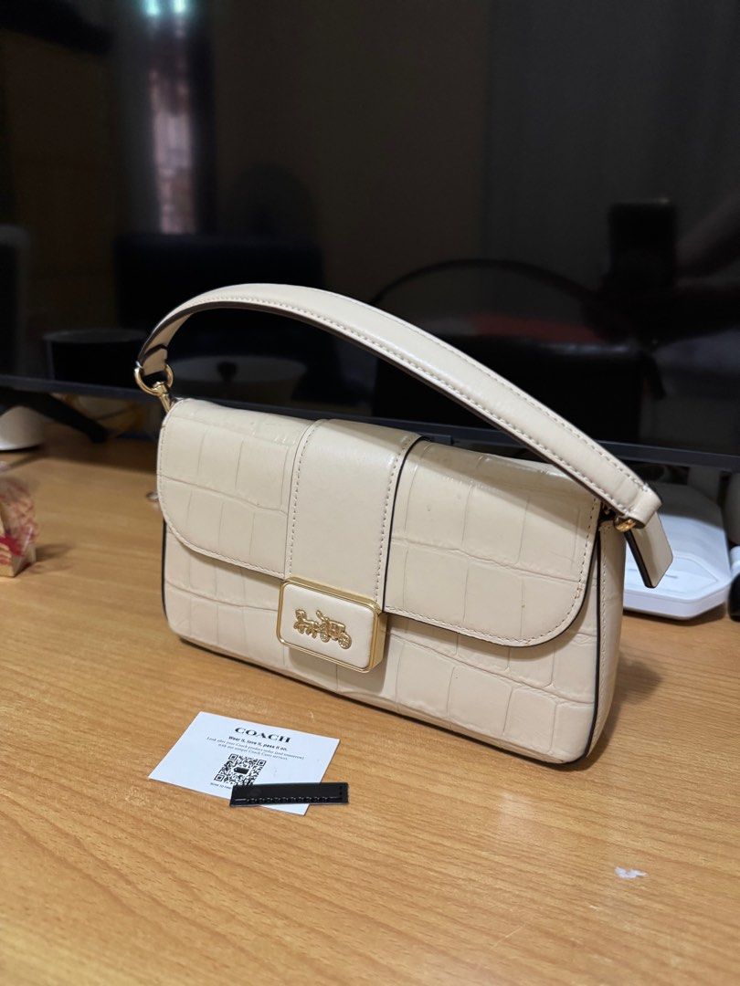 COACH Mini Grace Shoulder & Crossbody Bag (Category: Luxury Bags & Wallets) located in Dagupan City. Submitted by kassiedee (Listing ID 1371154411, Image 2). Description: Simple & nice slant one shoulder bag in crocodile leather pattern No issues **With dustbag.