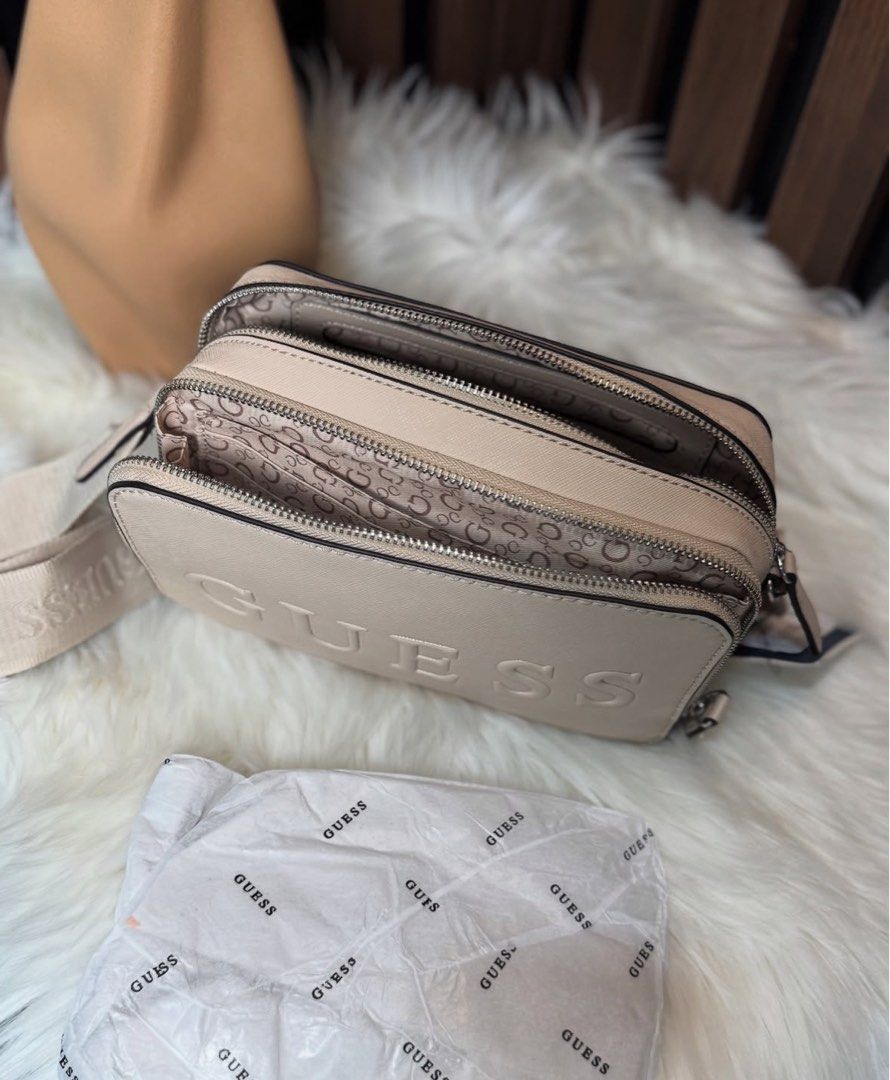 Guess bag (Category: Cross-body Bags) located in Agoo. Submitted by evtxzcs (Listing ID 1371094767, Image 2). Description: Original Guess Camera Bag From Canada Never been used!! .