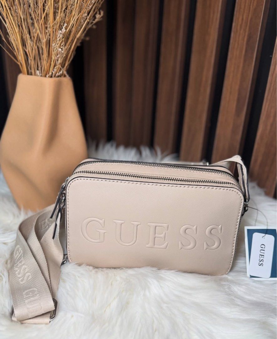 Guess bag (Category: Cross-body Bags) located in Agoo. Submitted by evtxzcs (Listing ID 1371094767, Image 1). Description: Original Guess Camera Bag From Canada Never been used!! .