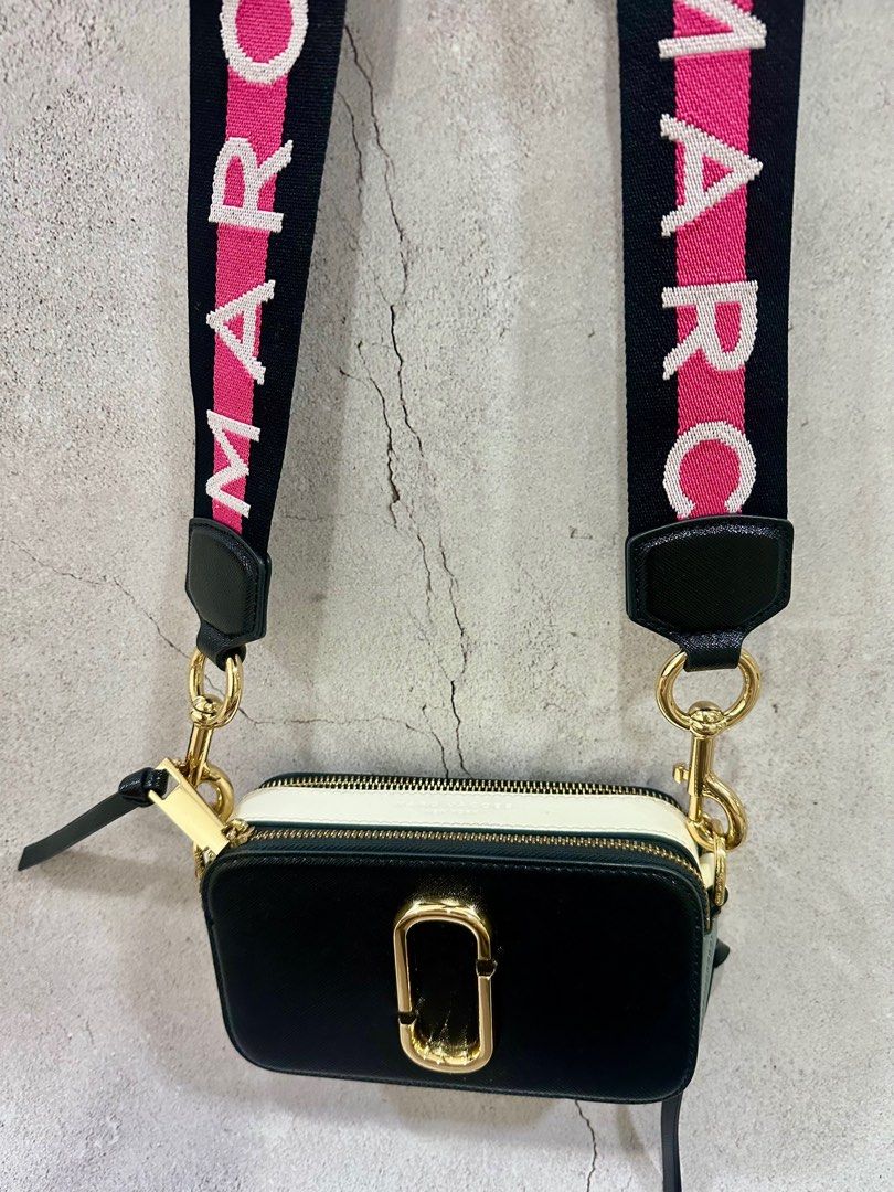 Marc Jacobs Snapshot Camera Bag (Category: Luxury Bags & Wallets) located in Pasay City. Submitted by jacknjiill (Listing ID 1371130583, Image 1). Description: Authentic Marc Jacobs With adjustable strap Gold hardware No dustbag Issues: minimal leather crack, faded in metal sling holder ( see photos) Rfs: decluttering .