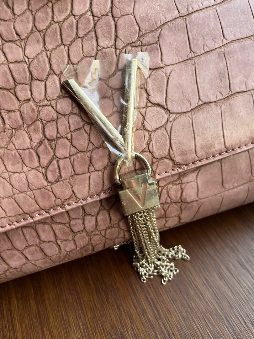 Mario Valentino audrey clutch bag (Category: Clutches) located in Calamba. Submitted by rosychix (Listing ID 1371096798, Image 2). Description: Pre-loved item Color: old rose Crocs leather has fadings on the sling .