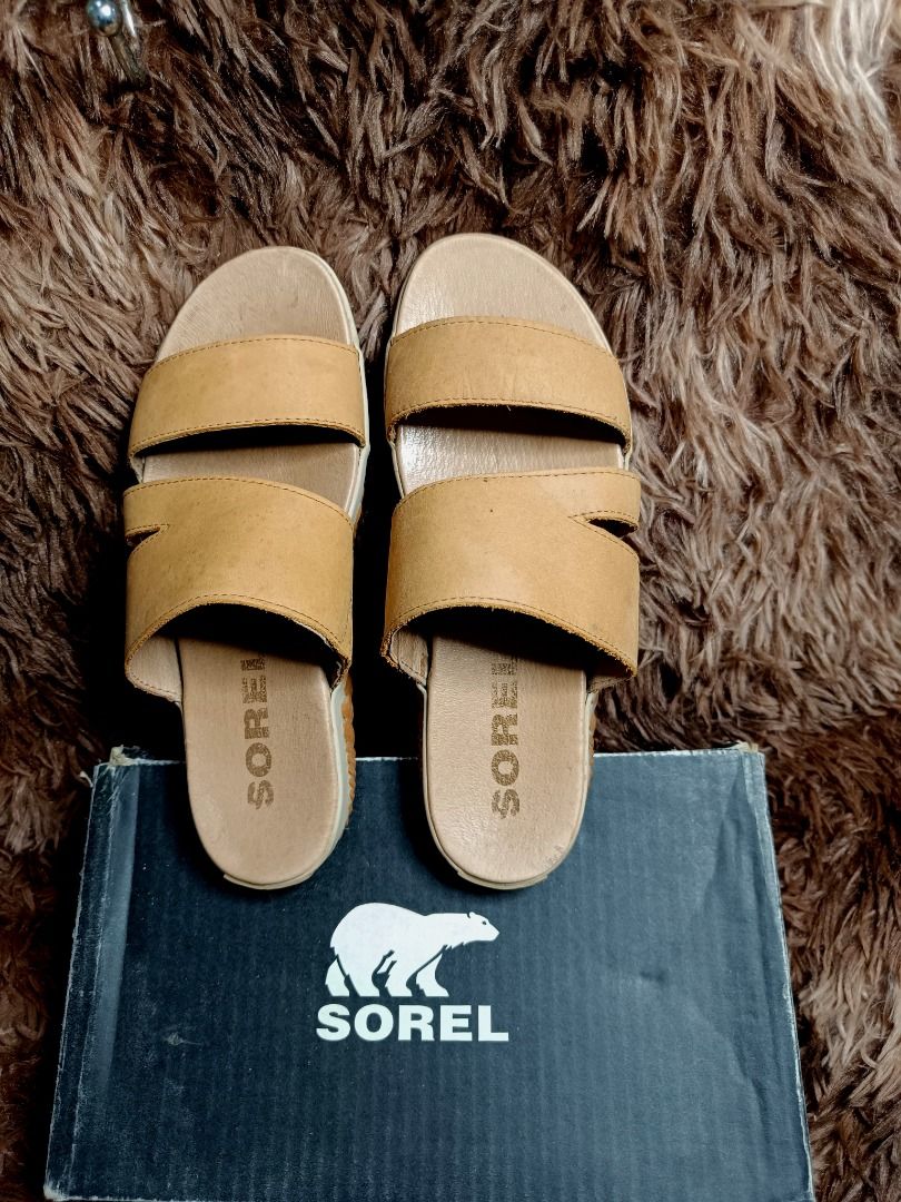 Sorel Out N About Plus slide (Category: Flats & Sandals) located in Rizal. Submitted by dims05 (Listing ID 1371021643, Image 1). Description: Easy, casual, and made for on-the-go days. This camel brown Sorel slide combines laid-back style with comfort, perfect for slipping on as you head out and about. The neutral tone pairs effortlessly with anything in your closet..