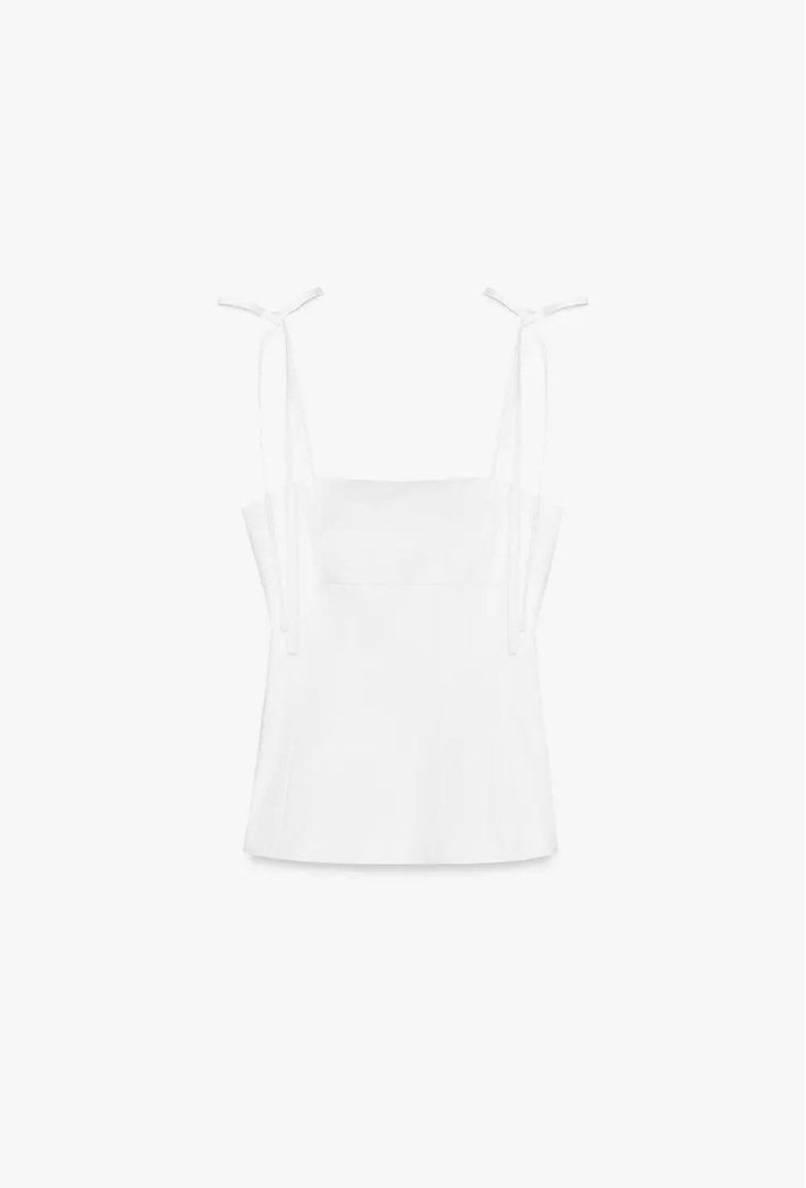 zara fitted top with bows (xs) (Category: Blouses) located in Quezon City. Submitted by eunnaaa (Listing ID 1371050975, Image 1). Description: bought in zara megamall - brand new never been worn - still has the tag - fits size xs mop : gcash .