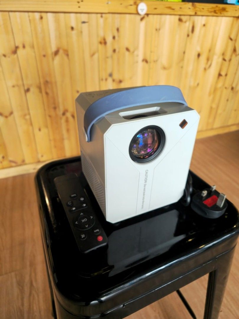 ANDROID PROJECTOR (Category: Projectors) located in Kuala Lumpur. Submitted by abujaa (Listing ID 1371225670, Image 2). Description: ANDROID PROJECTOR 🟢 NETFLIX 🟢 REMOTE 🟢 YOUTUBE 🟢 PLAY STORE 🟢USB + HDMI SLOT 🟢 ADJUSTABLE LANCE 🟢 SPEAKER GOOD QUALITY ANDROID PROJECTOR ONLY USED 2 TIME.