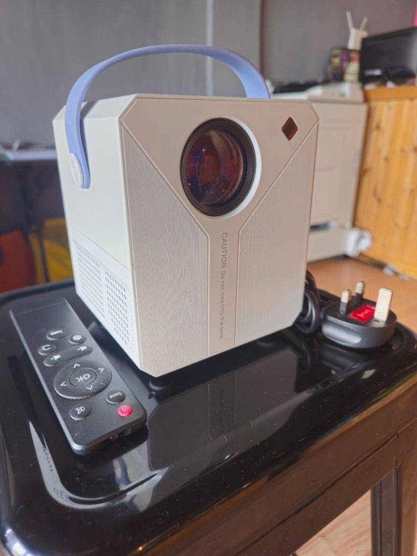 ANDROID PROJECTOR (Category: Projectors) located in Kuala Lumpur. Submitted by abujaa (Listing ID 1371225670, Image 3). Description: ANDROID PROJECTOR 🟢 NETFLIX 🟢 REMOTE 🟢 YOUTUBE 🟢 PLAY STORE 🟢USB + HDMI SLOT 🟢 ADJUSTABLE LANCE 🟢 SPEAKER GOOD QUALITY ANDROID PROJECTOR ONLY USED 2 TIME.