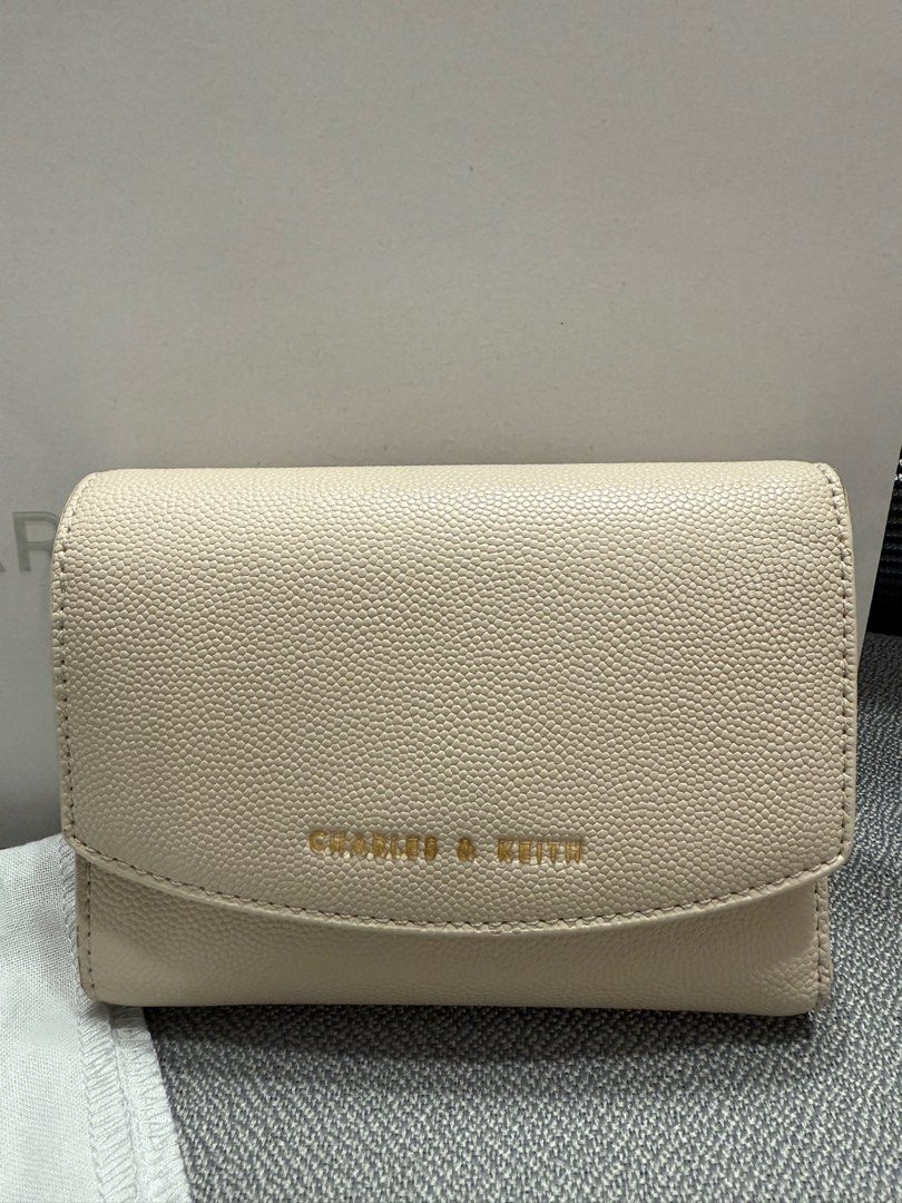Charles and Keith mini wallet (Category: Luxury Bags & Wallets) located in Manila. Submitted by thecuratedfind (Listing ID 1371260922, Image 2). Description: - lightly used - comes with box and paper bag - with minor issues (see last 3 photos) .
