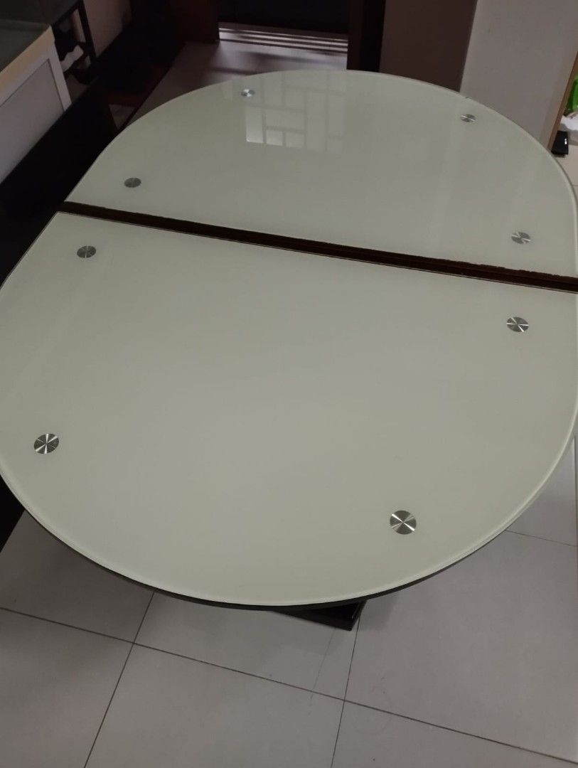 Dining Table (Category: Tables & Sets) located in Singapore. Submitted by jacktherippersss (Listing ID 1371332315, Image 1). Description: Expendable glass table $120 L115cm W 84cm H64cm unextended L145cm W84cm H74cm extended Foc 3 chairs self collect or delivery at $80.