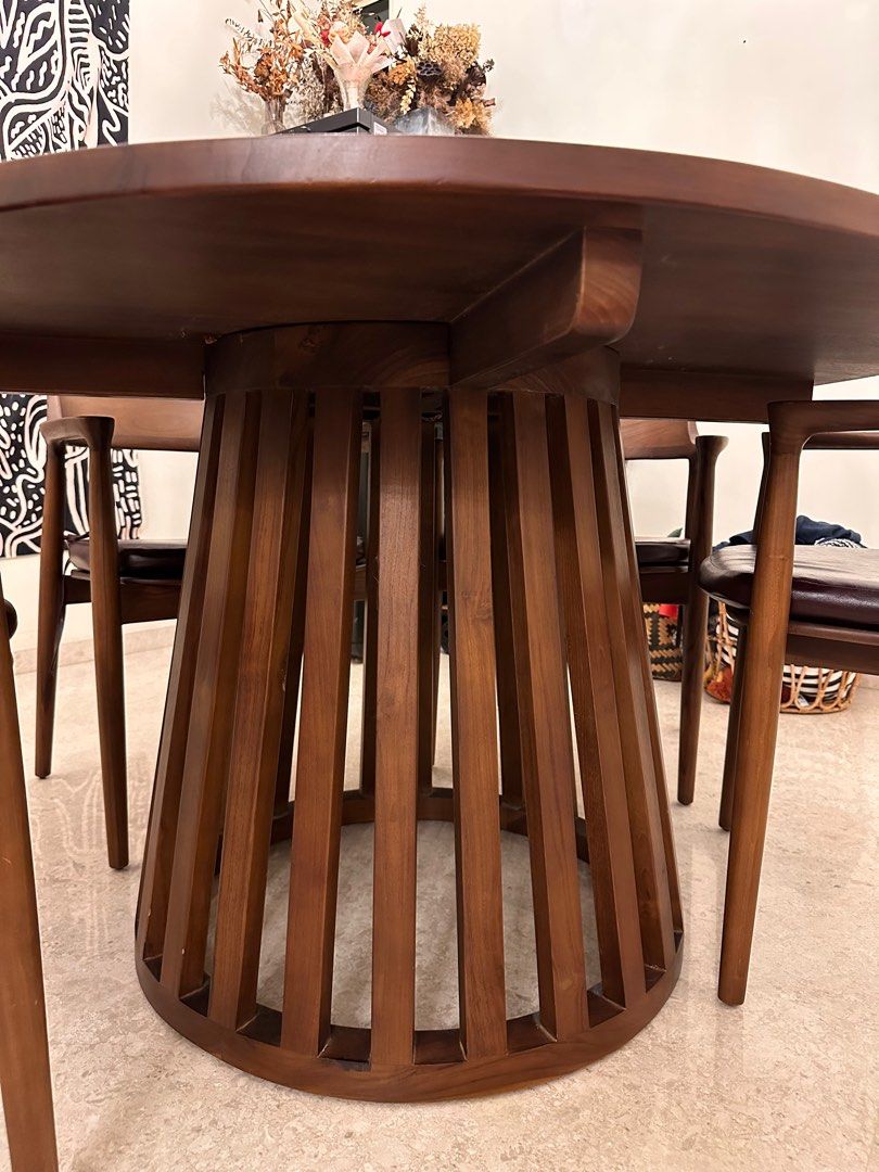 Dining set (Category: Tables & Sets) located in Singapore. Submitted by sapphfireee (Listing ID 1371303383, Image 3). Description: First photo is AI generated, inserting our table into a different interior design Custom made from Rooma in 2021 Table Diameter: 120CM Height: 76.5CM Some scratches and watermarks on the table, can be revarnished / repolished and will look brand new! 4 chairs included No defects on the chairs except the detachable lea