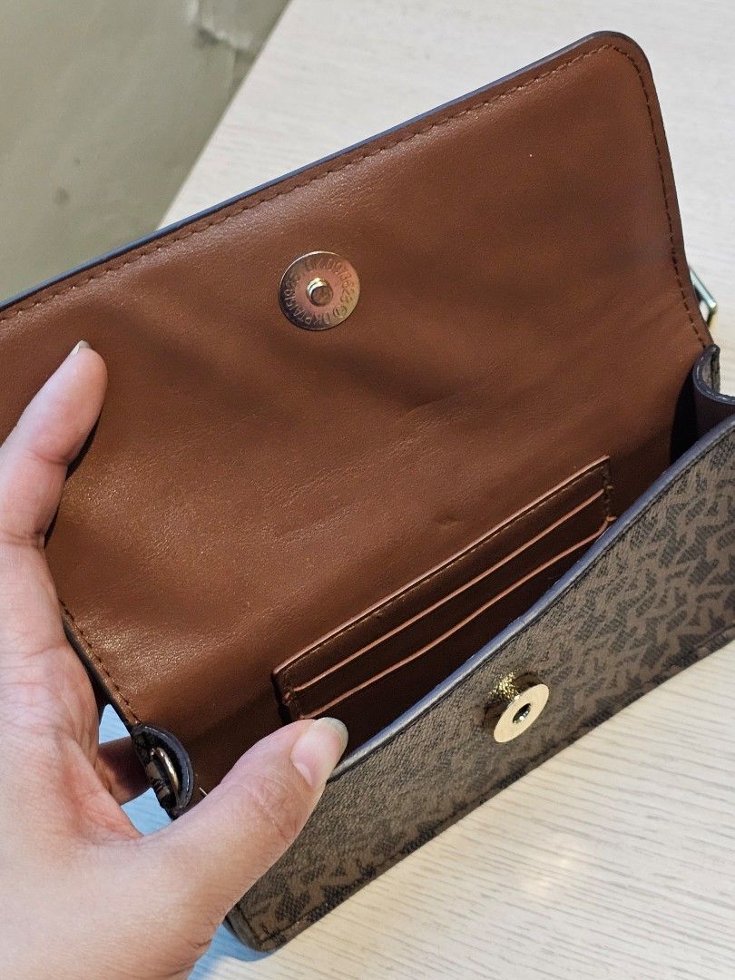 DKNY Monogram Belt Waist Bag (Category: Luxury Bags & Wallets) located in Manila. Submitted by mao.declutters (Listing ID 1371274771, Image 3). Description: Original preloved item Used a couple of times, no flaws at all Wristlet attachment missing Can nego if taking other items.