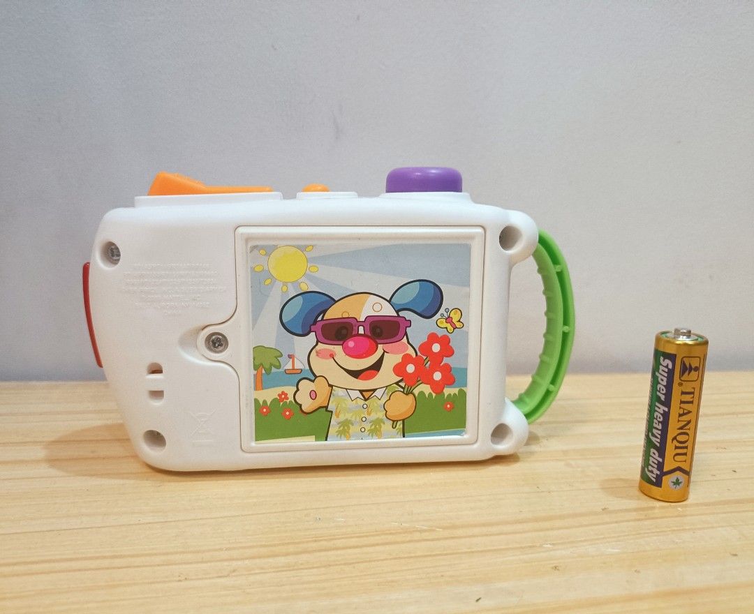 Fisher-Price Laugh & Learning Camera Toy (Category: Educational & Learning Toys) located in Quezon City. Submitted by babylianne (Listing ID 1371354897, Image 2). Description: Fisher-Price Laugh & Learning Camera Learning camera entertains baby with fun sounds and lights Hear phrases by batting at the smiley face Hear fun camera sounds when pressing the toggle Take pictures to hear fun sounds and songs Take the Learning Camera everywhere with the