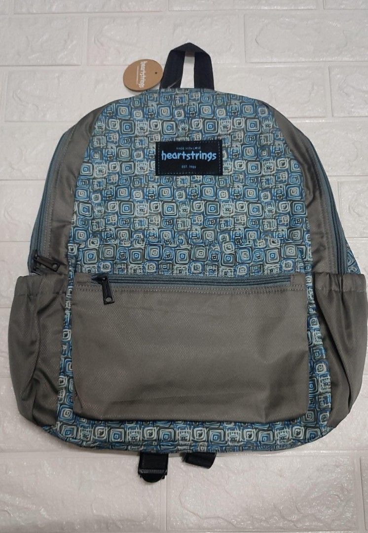 Gray Printed Backpack Heartstrings (Category: Backpacks) located in Quezon City. Submitted by gemaicloset (Listing ID 1371270456, Image 1). Description: 💯original.
