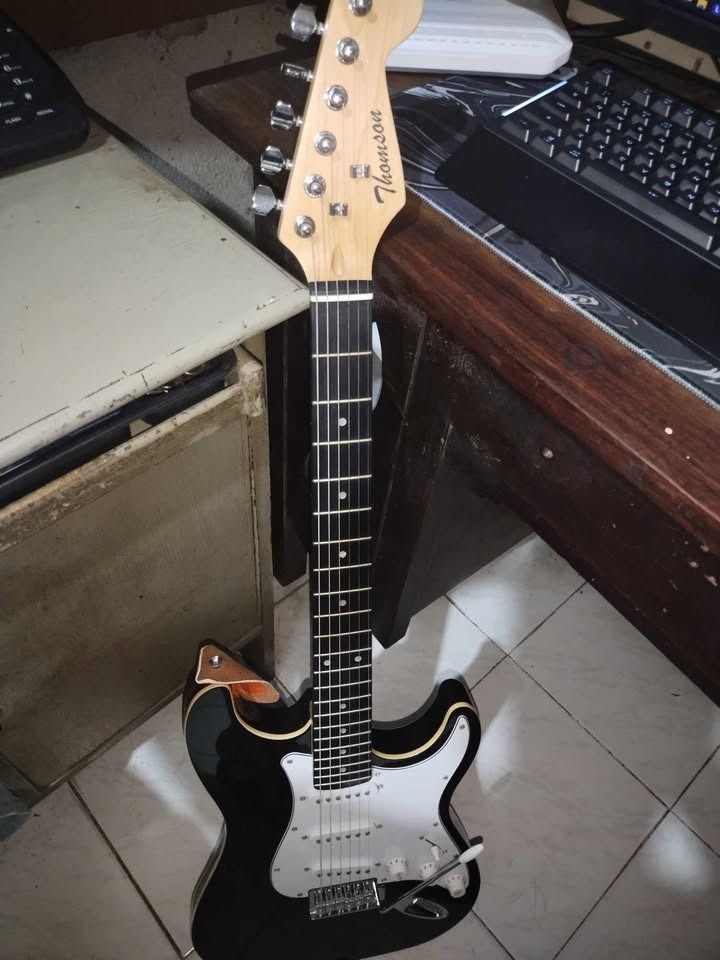 Thomson Electric Guitar (Category: Musical Instruments) located in Caloocan City. Submitted by vinsansz (Listing ID 1371201587, Image 1). Description: !!! STILL AVAILABLE !!! KUNIN NYO NA !!! Thomson Electric Guitar For Sale [ NEGOTIABLE PRICE ] - No Issues - Used for a few months only Inclusions: - Guitar Case - Pedal (w/ box) - Amplifier (w/box and guide) - 2x cords - Capo - Tuner (w/ battery included) - Extra strings.