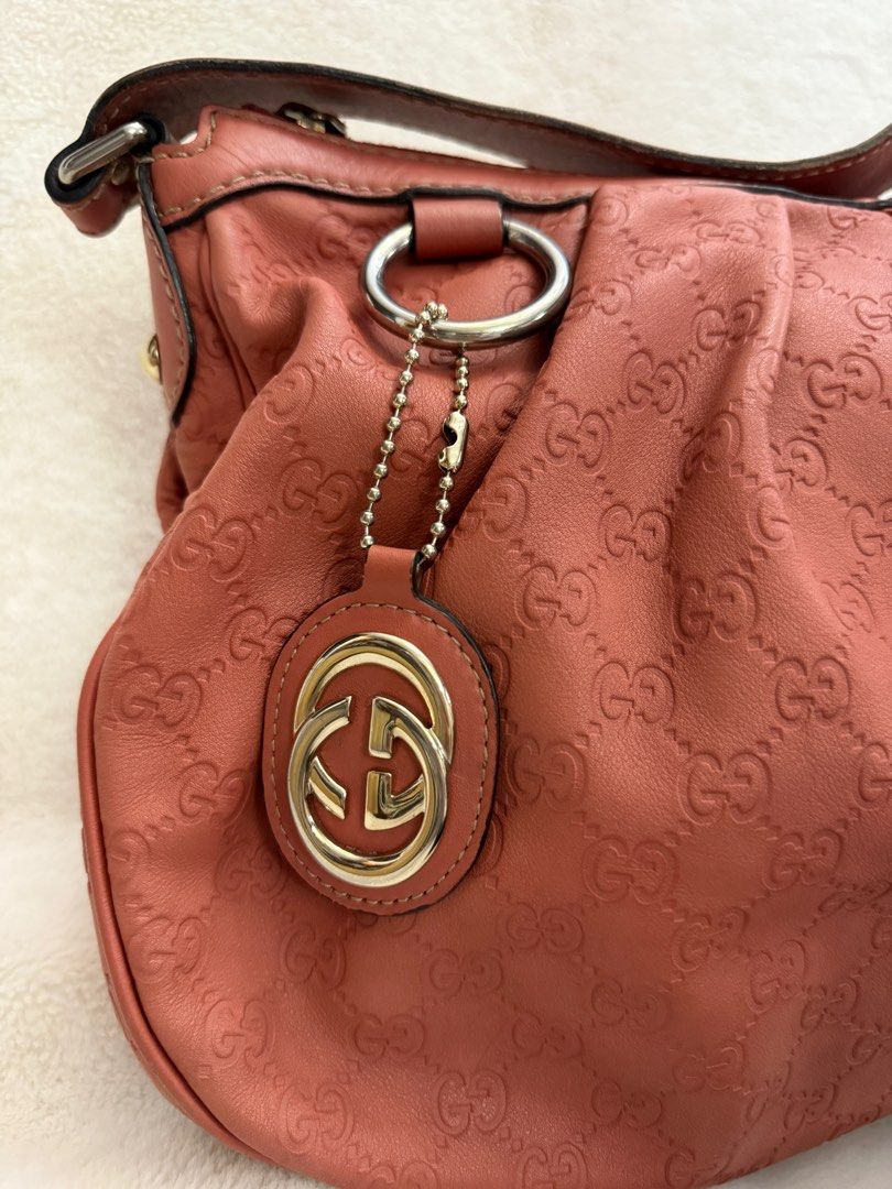 Authentic Gucci Guccissima Sukey Monogram Pink Medium Hobo (Category: Luxury Bags & Wallets) located in Paranaque City. Submitted by authentic_mj (Listing ID 1371507082, Image 2). Description: Authentic Gucci Guccissima Sukey Monogram Pink Medium Hobo Preloved Authentic from Japan With original dustbag Issue: - minor scuffs at the back - pen marks interior.