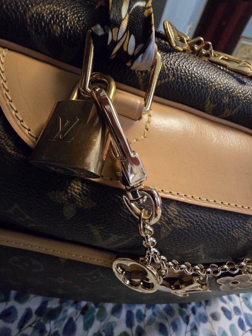 Authentic LV Deauville Monogram with Padlock and Entrupy Cert (CAV) (Category: Luxury Bags & Wallets) located in Manila. Submitted by happyladyprincess (Listing ID 1325773674, Image 2). Description: Authentic LV Deauville Monogram with Padlock and Entrupy Certificate of Authenticity Changed Vachetta, gold hardware are newly electroplated so it looks very fresh This is a very spacious handbag. still very good condition Inclusions: Entrupy Certific