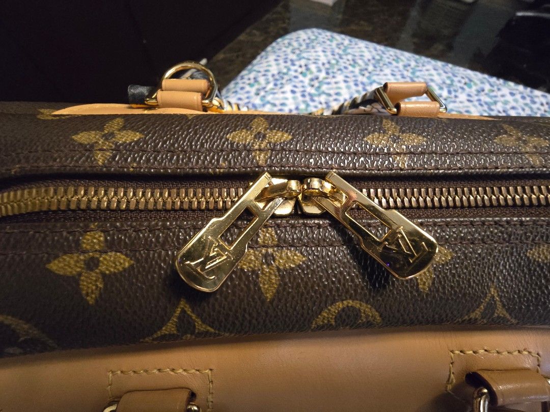 Authentic LV Deauville Monogram with Padlock and Entrupy Cert (CAV) (Category: Luxury Bags & Wallets) located in Manila. Submitted by happyladyprincess (Listing ID 1325773674, Image 3). Description: Authentic LV Deauville Monogram with Padlock and Entrupy Certificate of Authenticity Changed Vachetta, gold hardware are newly electroplated so it looks very fresh This is a very spacious handbag. still very good condition Inclusions: Entrupy Certific