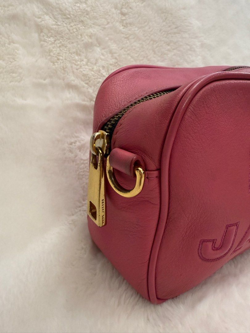 Authentic Marc Jacobs Leather Flash Pink Embossed Crossbody Bag (Category: Luxury Bags & Wallets) located in Paranaque City. Submitted by authentic_mj (Listing ID 1371538614, Image 3). Description: Authentic Marc Jacobs Leather Flash Pink Embossed Crossbody Bag Preloved Authentic from Japan With 2 original straps Issue: sign of use.