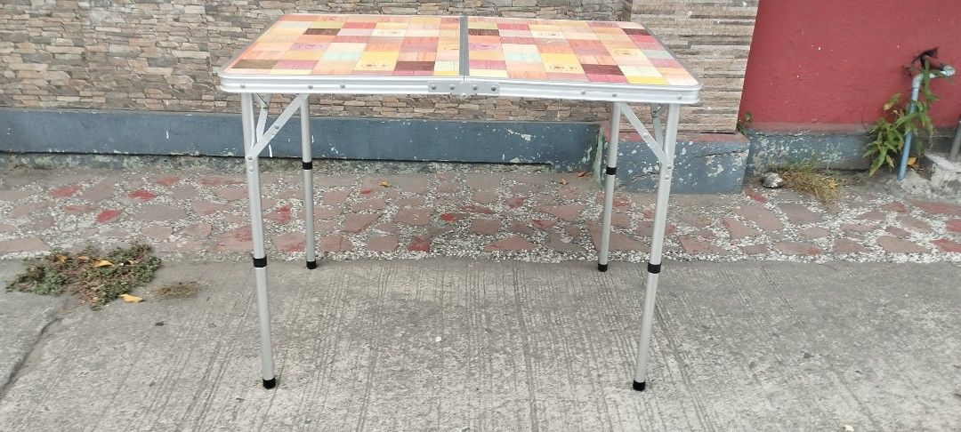 Coleman natural mosaic living Table folding hight & low (Category: Hiking & Camping) located in Malabon City. Submitted by immortalpicker (Listing ID 1371465439, Image 1). Description: Coleman natural mosaic living Table ,folding high & low table Brand= Coleman folding table Model- 90 plus NO to COD NO swapping narmal size H= 27 3/4 inches L= 35 1/2 Inches W= 23 3/4 inches Low table H= 15 3/4 Folded size H= 17 3/4 inches L= 23 3/4 inches W= 2 3/4