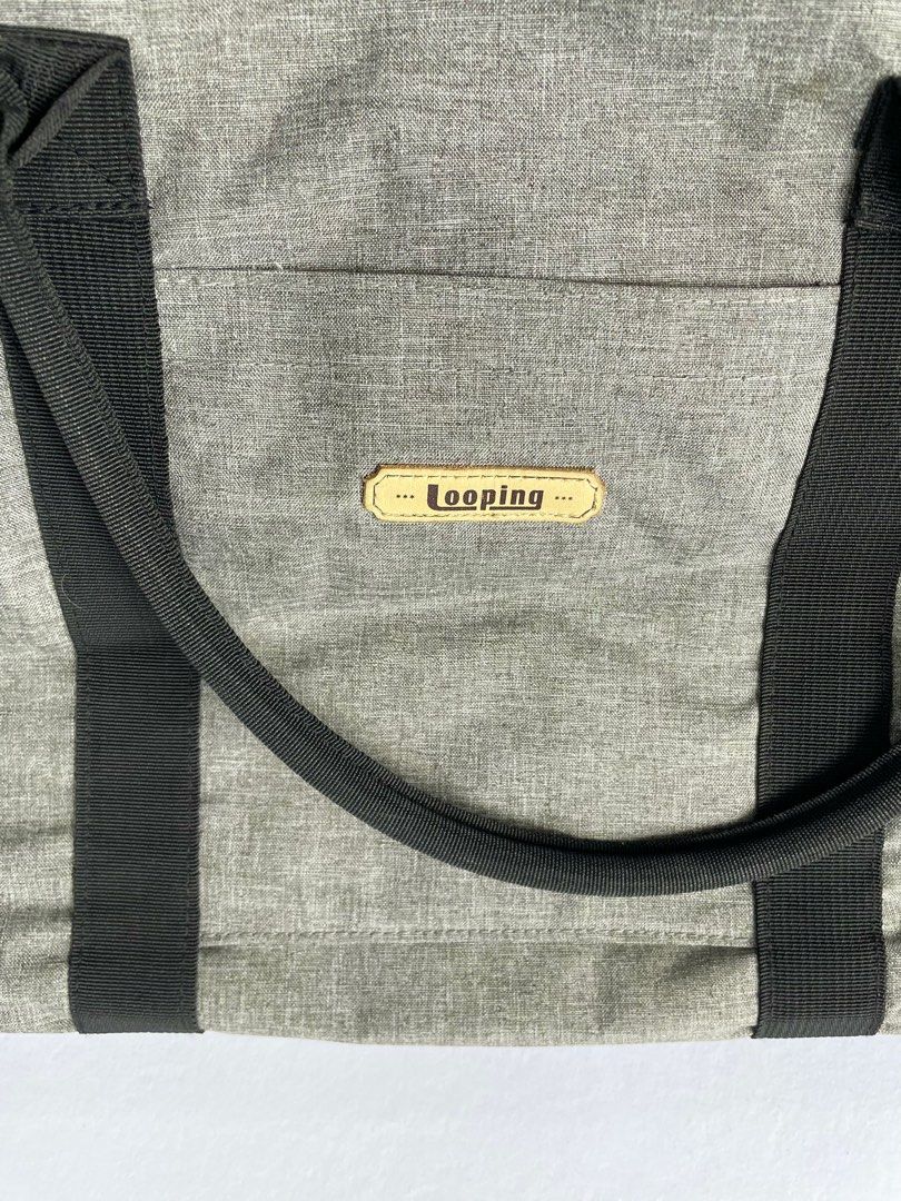 Looping Signature Travel Bag (Category: Diaper Bags & Wetbags) located in Quezon City. Submitted by discoversomethingnice (Listing ID 1371527286, Image 2). Description: Large and roomy travel or diaper bag for your baby’s essentials. Original Price: 4,000.00 Selling Price: 1,100.00 Condition: 7/10 – Pre-loved with visible wear; a deep clean will refresh them nicely. .