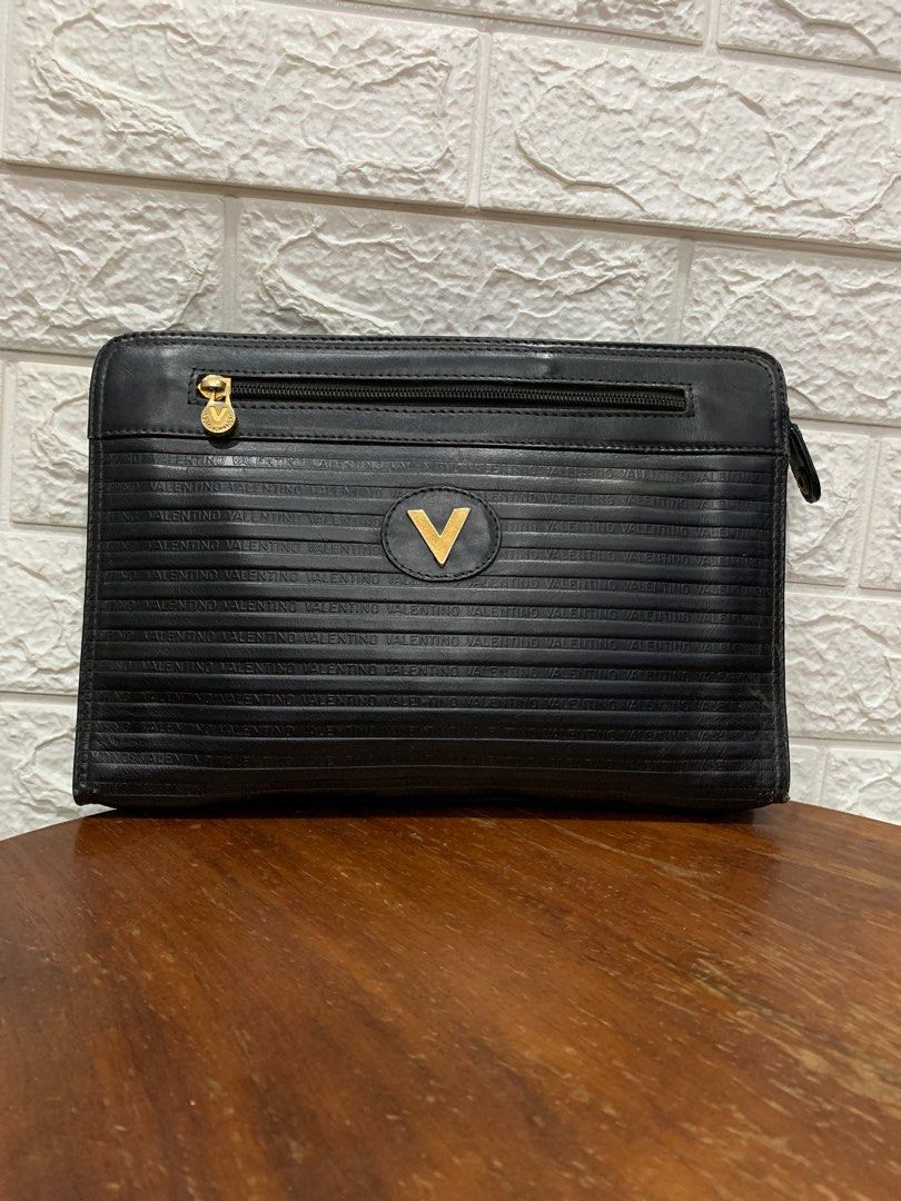 Mario Valentino clutch bag (Category: Luxury Bags & Wallets) located in Taguig. Submitted by prelovey_dovey_725 (Listing ID 1371409252, Image 1). Description: Payment first thru Gcash Shipping via J&T, lalamove.
