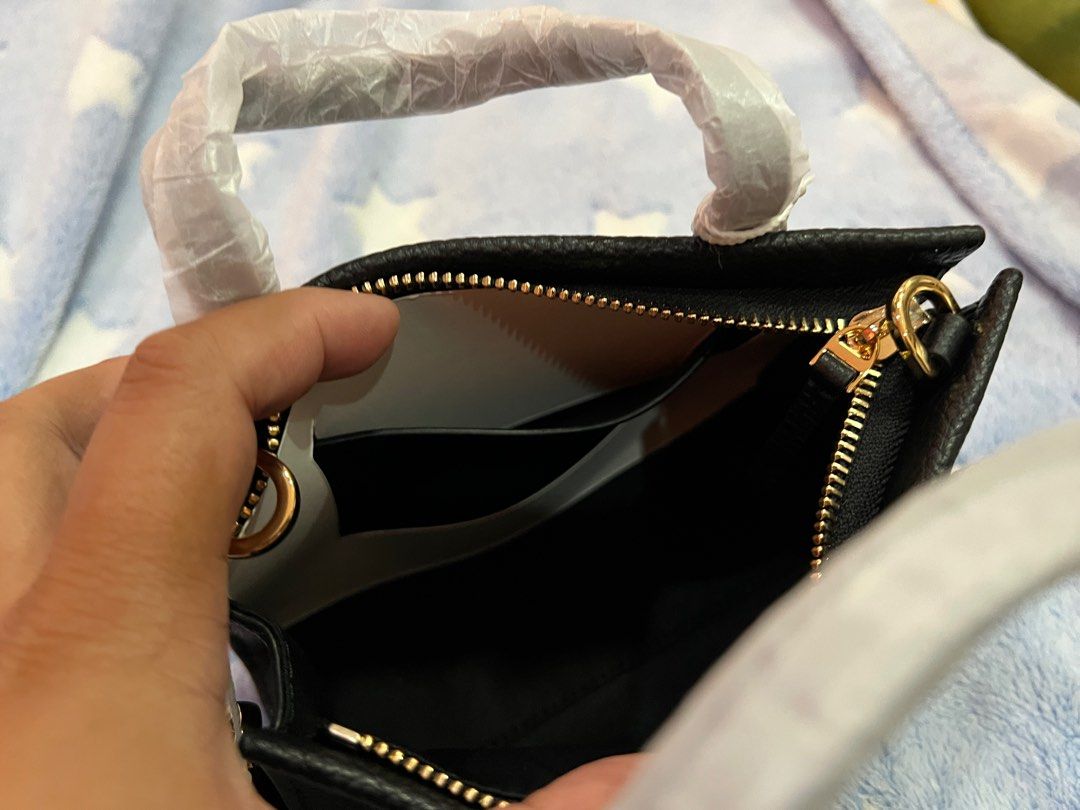 Tory Burch Black Mini Tote - Black (Category: Luxury Bags & Wallets) located in San Pedro. Submitted by misslumi (Listing ID 1371390075, Image 3). Description: Brand New from US Outlet store!!! Fits 13" pro max. Has enough space for card wallet. Actual photo posted..
