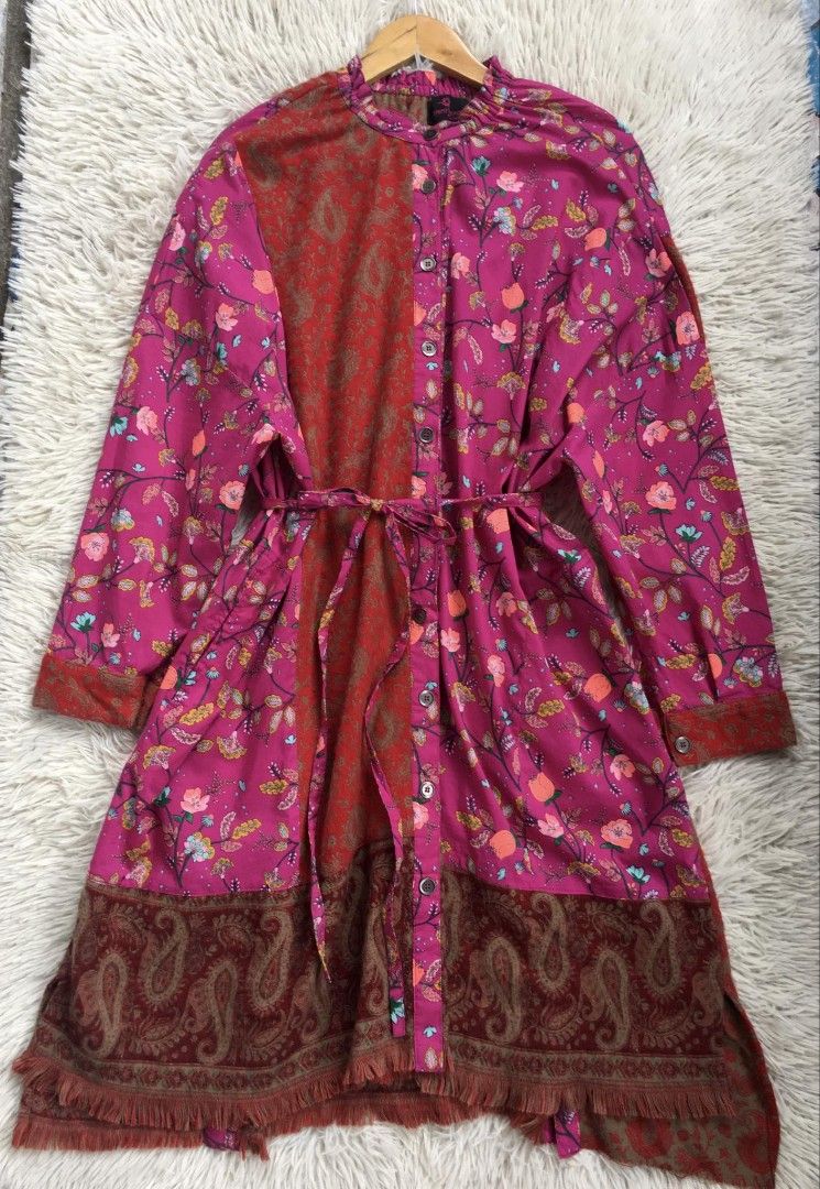 Vibrant floral Design (Category: Dresses) located in Tarlac. Submitted by aprilcalim69273 (Listing ID 1371493429, Image 3). Description: ●Actual Measurements •Bustline up to 42" •Waistline up to 42" •Lenght 40" ♡long-sleeved, button-down dress featuring a vibrant, floral design in shades of pink, red, and brown. The dress has a contrasting panel down the center and a tie belt at the waist. It has a button-down front.The hem of the dress has a fri