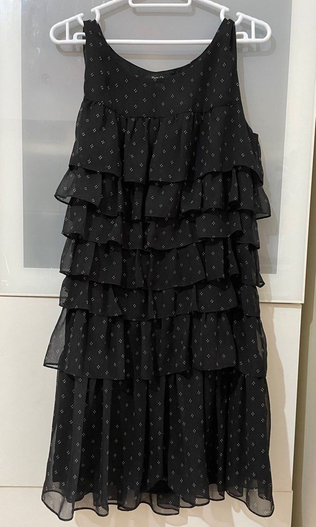 Black Tiered Ruffle mini dress (Category: Dresses) located in Taguig. Submitted by lam_decluttering (Listing ID 1371642293, Image 2). Description: Black round neck sleeves tiered ruffle shift mini dress fabric : chiffon polyester can fit from XS to Small.