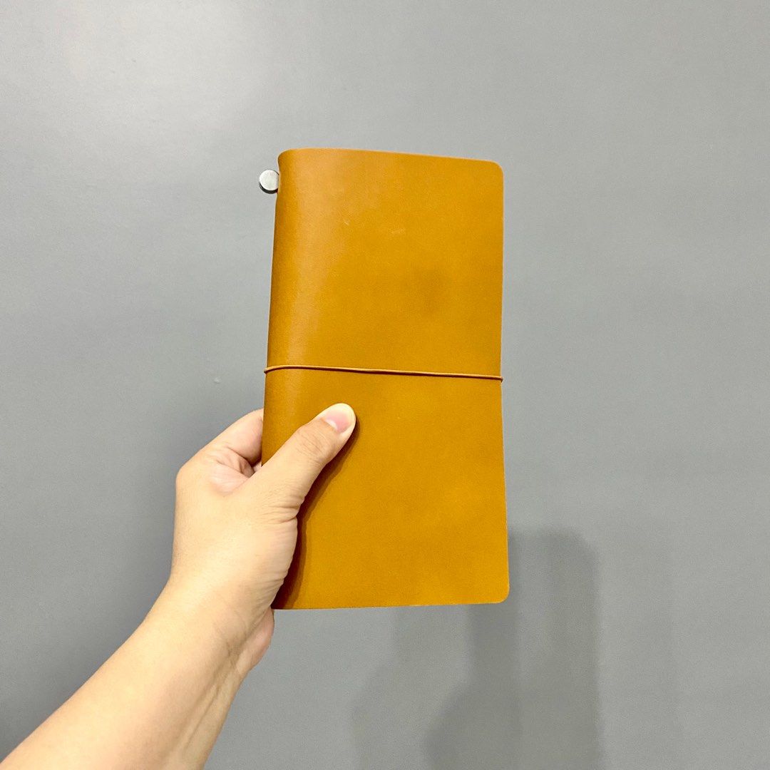 Collasaro Leather Notebook (Category: Stationery & School Supplies) located in Makati City. Submitted by aideclutter (Listing ID 1371645924, Image 1). Description: • Genuine Leather The leather is called “oil leather,” it becomes shinier and changes in color and texture as it ages. WARNING: This leather easily scratches. • Japanese brand Shipped from Japan • Color : Caramel • Size Leather cover : 22 cm x 12.5 cm Notebook inserts : 21 cm x 11 cm •
