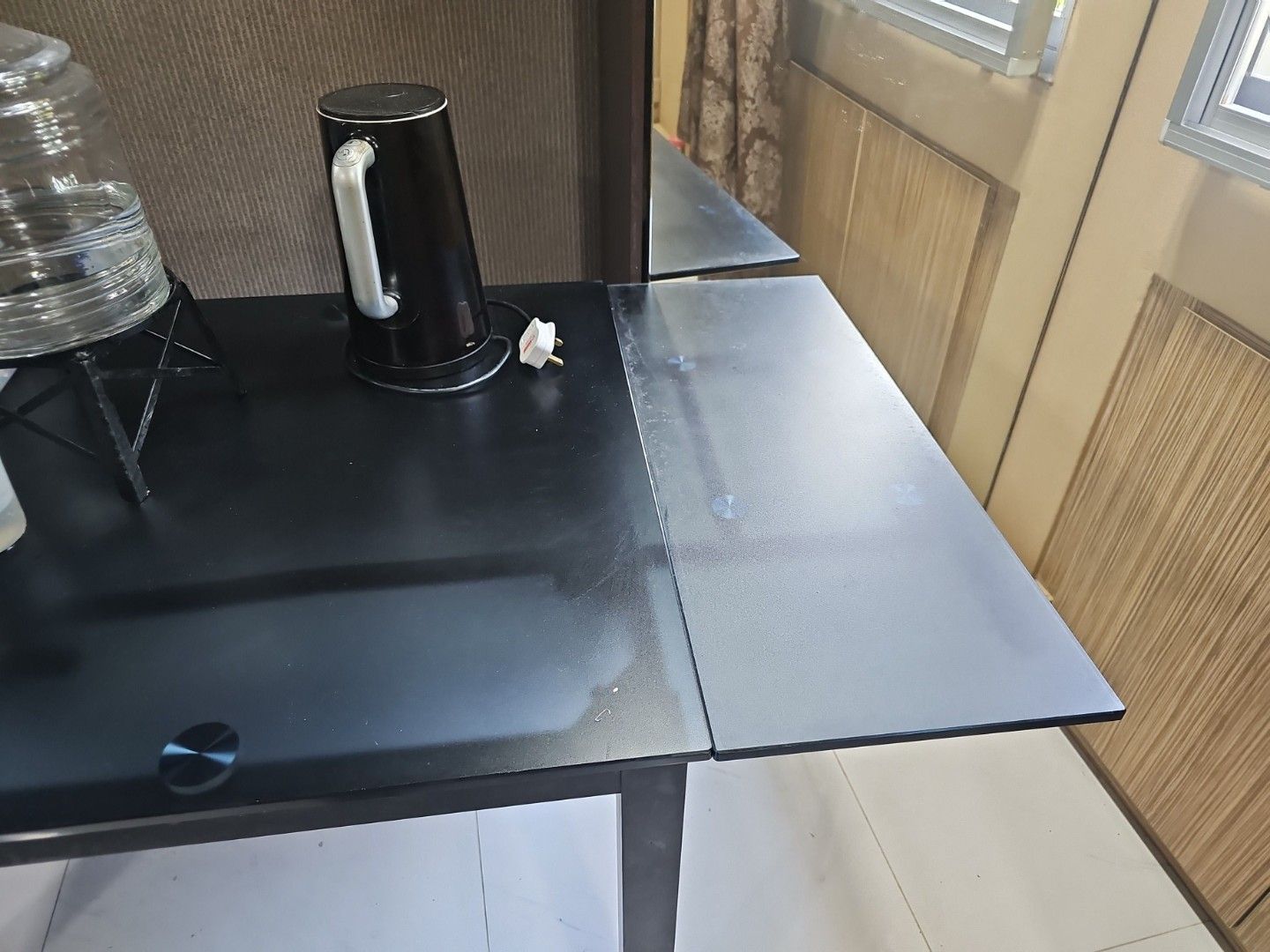 Dining Table (Category: Bathroom & Kitchen Fixtures) located in Singapore. Submitted by justbittersweet (Listing ID 1371584158, Image 3). Description: 110cm x 75cm. extendable to arnd 170cm. Pictures show extended.black frosted glass top. metal legs.