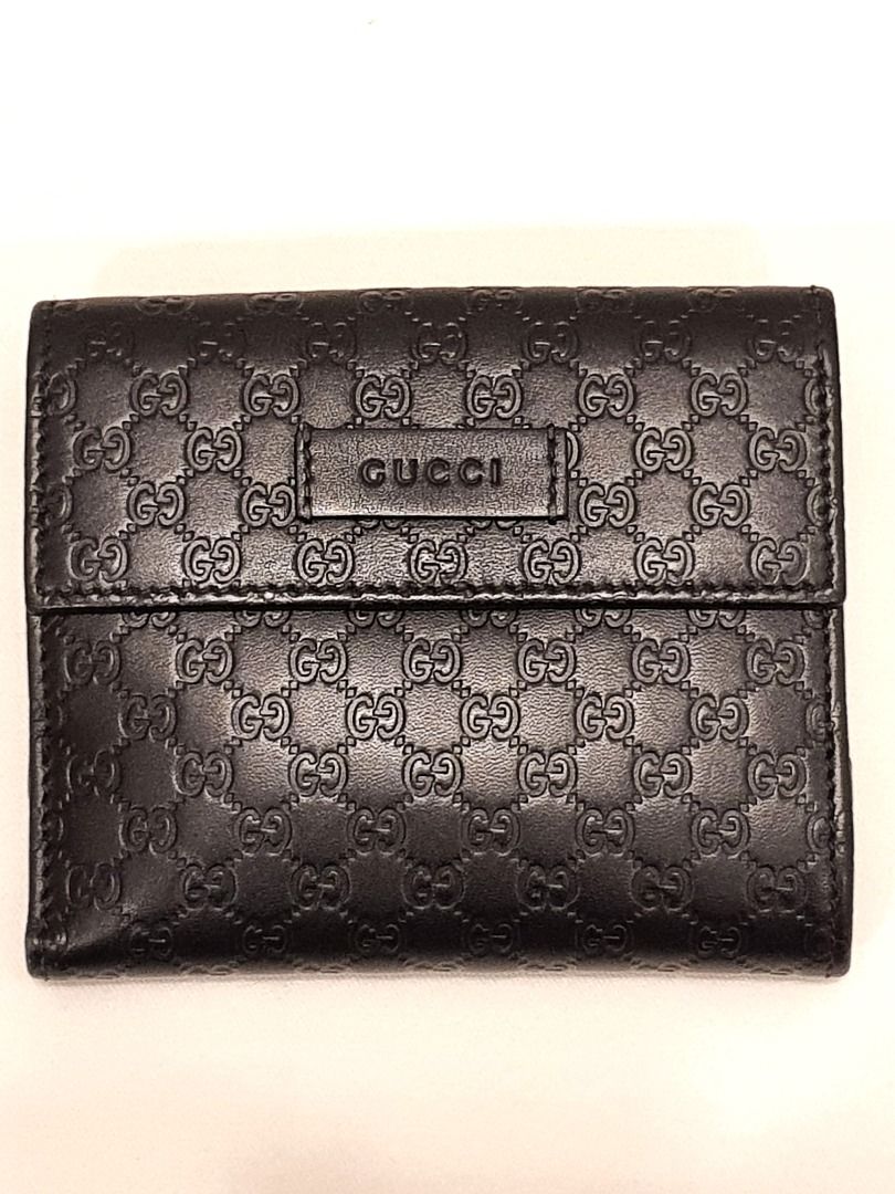 Gucci GG Embossed Black Leather Wallet (Category: Wallets & Card holders) located in Las Pinas. Submitted by therealmacynn (Listing ID 1371586163, Image 2). Description: Gucci wallet in GG monogram black leather. Coin purse on one side, opening on the other side has 4 card slots on either side and double bill compartments. Like new condition, comes with the dust bag, cards and box. The posted price is the last price. Shipping is free anywhere in 