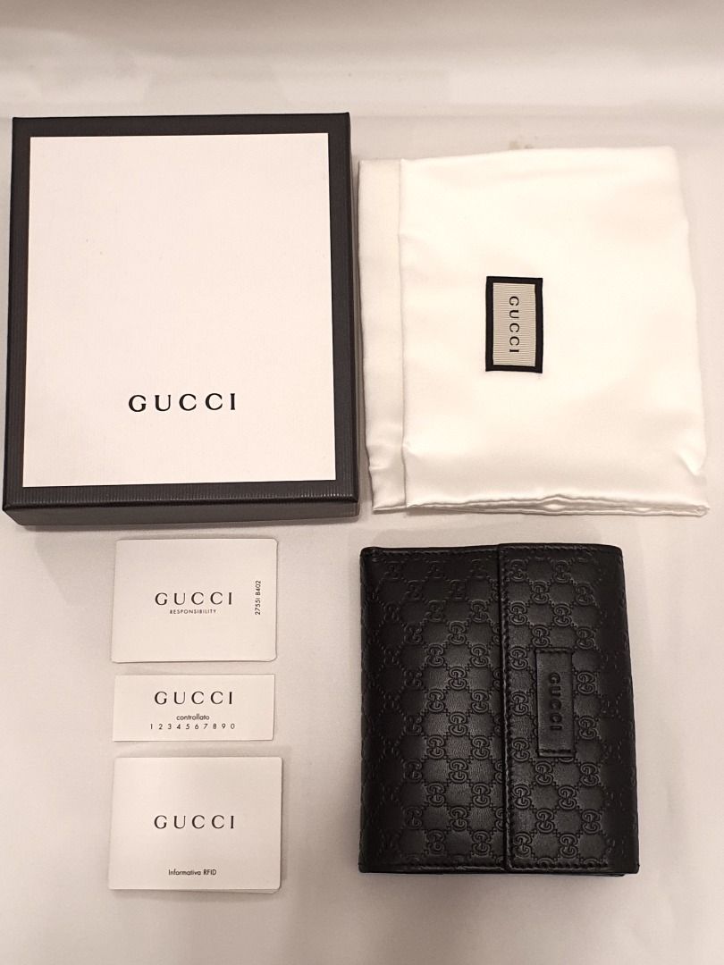 Gucci GG Embossed Black Leather Wallet (Category: Wallets & Card holders) located in Las Pinas. Submitted by therealmacynn (Listing ID 1371586163, Image 1). Description: Gucci wallet in GG monogram black leather. Coin purse on one side, opening on the other side has 4 card slots on either side and double bill compartments. Like new condition, comes with the dust bag, cards and box. The posted price is the last price. Shipping is free anywhere in 