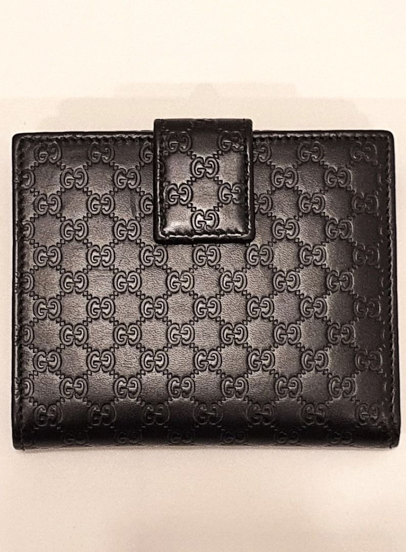 Gucci GG Embossed Black Leather Wallet (Category: Wallets & Card holders) located in Las Pinas. Submitted by therealmacynn (Listing ID 1371586163, Image 3). Description: Gucci wallet in GG monogram black leather. Coin purse on one side, opening on the other side has 4 card slots on either side and double bill compartments. Like new condition, comes with the dust bag, cards and box. The posted price is the last price. Shipping is free anywhere in 