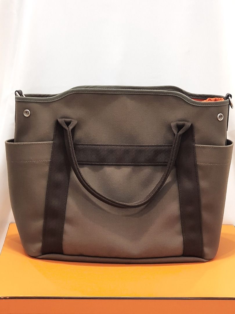 Hermes Grooming Bag Sac de Pansage (Category: Luxury Bags & Wallets) located in Las Pinas. Submitted by therealmacynn (Listing ID 1371591051, Image 2). Description: Hermes Sac de Pansage grooming bag. Body is olive green water-repelling coated canvas. Palladium hardware. There are 3 external pockets and three internal pockets, one with a zipper opening. Includes removable inner cover, removable shoulder strap, dust bag and box. The posted price i