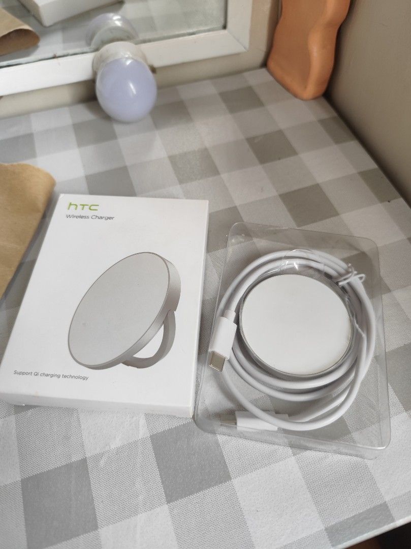 HTC Wireless charger high quality (Category: Chargers & Cables) located in Cavite. Submitted by jane_ava (Listing ID 1371559812, Image 1). Description: reg price: 1,199 HTC Wireless Charger 100% Genuine / Brand New / Sealed features: - Output: Up to 15W - Port: USB Type-C - Standard: Qi Compatible - Diameter: 57mm - Thickness: 7mm - Short-circuit protection - Overcurrent Protection - Overvoltage protection What's in the box: 1 x HTC Wireless Char