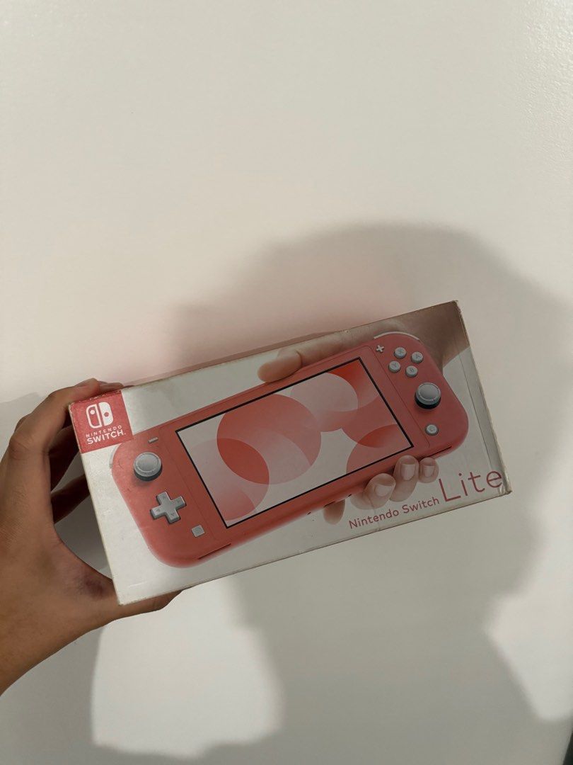 Nintendo Switch Lite Pink (Category: Nintendo) located in Rodriguez. Submitted by babytoothy (Listing ID 1371722911, Image 2). Description: pm me for more details w box no issue w replacement charger .