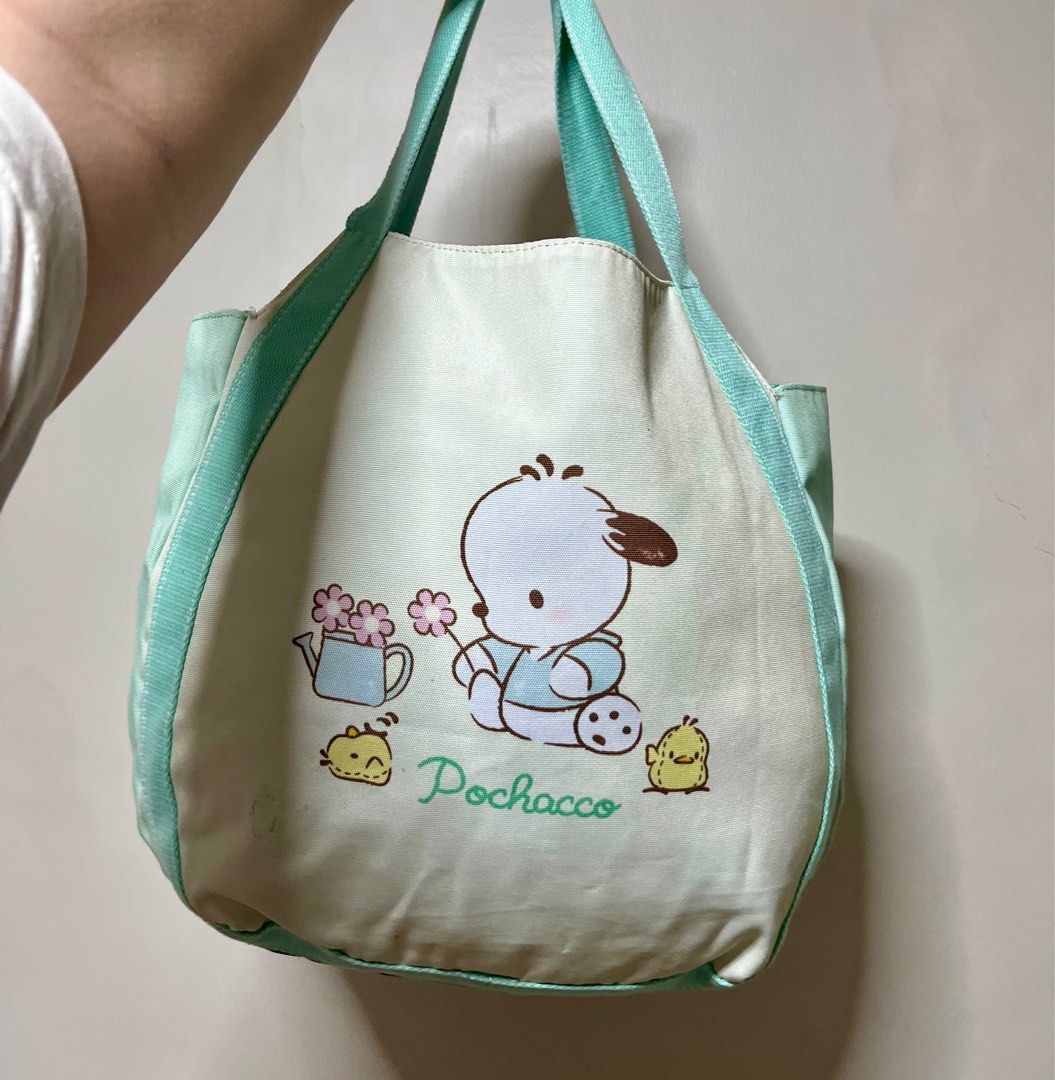 Pochacco Nylon Tote Bag (Category: Tote Bags) located in Valenzuela. Submitted by any_thingthings (Listing ID 1371656274, Image 1). Description: [LAST PRICE] Has 2 side pockets inside Has ballpen ink stain Rfs: Decluttering.