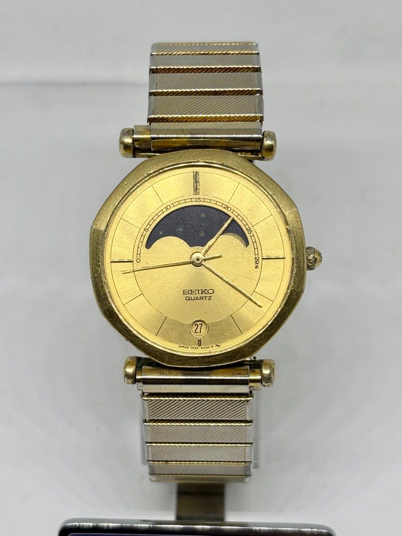 Seiko Moonphase 7434 Gold Filled Watch (Category: Luxury Watches) located in Subic. Submitted by modern.vintage.enthusiast (Listing ID 1371709533, Image 1). Description: •Seiko moonphase watch •All original watch head •Ref 7434 6020 •Quartz movement working well newly service •Sunburst gold color dial •33mm case diameter •19mm lug size •Bmby 1985 November Please see photos for best description Feel free to DM for more details of the watch Thanks 