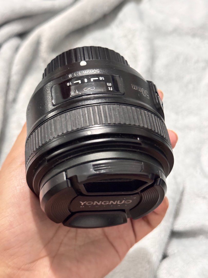 Yongnuo 50mm Lens for Nikon Camera (Category: Lens & Kits) located in Quezon City. Submitted by clothes_co (Listing ID 1371672702, Image 2). Description: Lens only Well used without issues rfs: Switching to Fujifilm mirrorless camera.